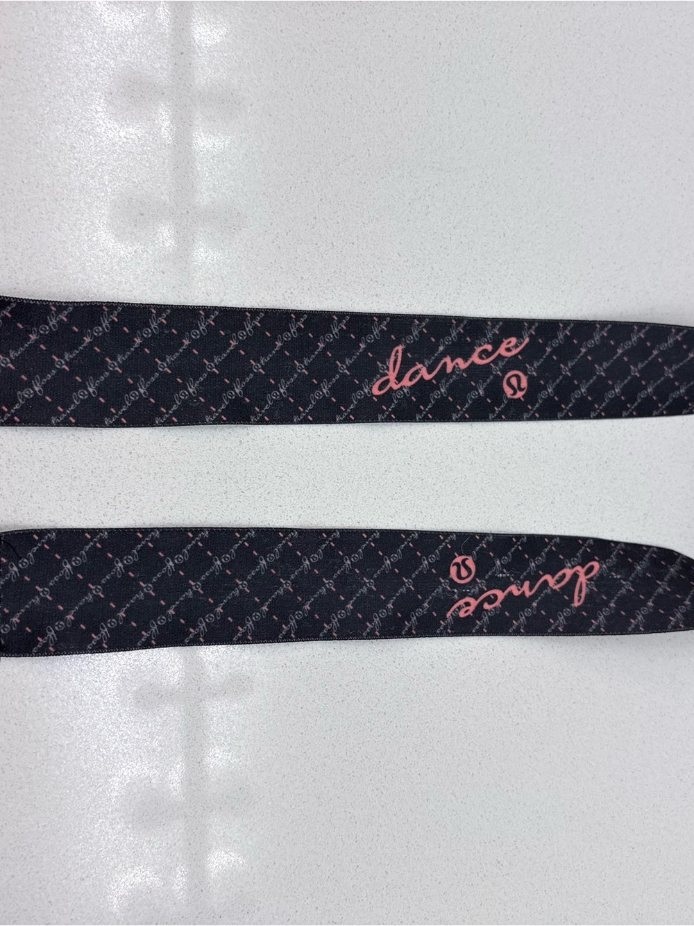 lululemon athletica Black stretchy belt with Pink "dance" Script